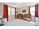 Bedroom featuring two cribs, red curtains, and neutral walls at 262 Country Lake Dr, Mooresville, NC 28115