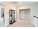 Hallway with view of white double doors and decorative shelving at 262 Country Lake Dr, Mooresville, NC 28115