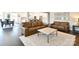 Spacious living room with hardwood floors, leather sofas, and an open floor plan at 262 Country Lake Dr, Mooresville, NC 28115