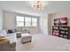 Bright living room with a large window and comfortable sectional couch at 262 Country Lake Dr, Mooresville, NC 28115
