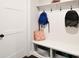 Bright mudroom features bench seating, storage cubbies, and wall hooks for organization at 262 Country Lake Dr, Mooresville, NC 28115