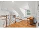 Finished attic space with hardwood floors, natural light, and a cozy window seat at 2900 Wickersham Rd, Charlotte, NC 28211