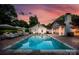 Beautiful backyard featuring a large pool, lounge chairs, manicured landscaping, and an outdoor seating area at 2900 Wickersham Rd, Charlotte, NC 28211