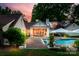 Outdoor space with a pool, jacuzzi, patio, lush landscaping, and inviting seating, ideal for outdoor living at 2900 Wickersham Rd, Charlotte, NC 28211