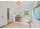 Charming foyer with a light fixture, wooden chest, decor, and a front door with beautiful natural light at 2900 Wickersham Rd, Charlotte, NC 28211