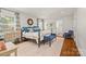 Bright main bedroom featuring hardwood floors, stylish decor, and lots of natural light at 2900 Wickersham Rd, Charlotte, NC 28211