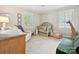 Comfortable bedroom with neutral tones, two windows, and a floral patterned rug at 3128 Country Club Dr, Charlotte, NC 28205