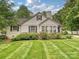 Well-maintained lawn and landscaping complement the exterior of this inviting home at 3128 Country Club Dr, Charlotte, NC 28205