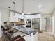Updated kitchen featuring stainless steel appliances, stone countertops, and white cabinets at 3128 Country Club Dr, Charlotte, NC 28205