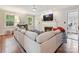 Comfortable living area features a fireplace, hardwood floors, and plenty of natural light at 3128 Country Club Dr, Charlotte, NC 28205