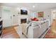 Inviting living room with a fireplace, hardwood floors, and stylish decor at 3128 Country Club Dr, Charlotte, NC 28205