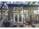 Backyard with patio featuring outdoor seating under tree and partial fence views at 3131 Heathstead Pl, Charlotte, NC 28210
