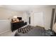 Comfortable bedroom featuring neutral color scheme and closet at 3131 Heathstead Pl, Charlotte, NC 28210