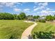 Expansive common area features a covered picnic space and a paved walking path at 3131 Heathstead Pl, Charlotte, NC 28210