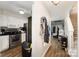 Open entryway showcasing modern kitchen, hallway, and stairs at 3131 Heathstead Pl, Charlotte, NC 28210