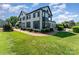 Charming two-story home with beautiful landscaping, a manicured lawn, and a brick walkway at 3131 Heathstead Pl, Charlotte, NC 28210