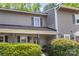 Two-story townhouse featuring a cozy front porch and well-kept landscaping at 3131 Heathstead Pl, Charlotte, NC 28210