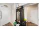 Hallway with wood-look floors featuring a large antique cabinet with mirrored facade at 3131 Heathstead Pl, Charlotte, NC 28210
