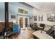 Cozy living room with fireplace, wood floors, and natural light from the backyard at 3131 Heathstead Pl, Charlotte, NC 28210