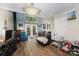 Open living room with a brick fireplace and French doors leading to the backyard, perfect for relaxation at 3131 Heathstead Pl, Charlotte, NC 28210
