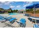 Community pool with lounge chairs and umbrellas for residents to enjoy the summer months at 3131 Heathstead Pl, Charlotte, NC 28210