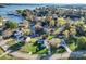Gorgeous aerial view of the home nestled in a lush neighborhood with access to the lake and marina at 317 Commodore Loop, Mooresville, NC 28117