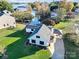 Beautiful aerial view of lakeside house with manicured lawn and inviting outdoor space at 317 Commodore Loop, Mooresville, NC 28117