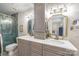 Elegant bathroom with double sinks, marble countertops, and a luxurious glass shower at 317 Commodore Loop, Mooresville, NC 28117