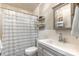 Clean bathroom with a shower, sink, vanity mirror, and fresh white and gray tones at 317 Commodore Loop, Mooresville, NC 28117