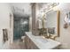 Elegant bathroom with double sinks, marble countertops, and a luxurious glass shower at 317 Commodore Loop, Mooresville, NC 28117