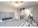 Relaxing bedroom with a queen-size bed, soft lighting, and closet storage space at 317 Commodore Loop, Mooresville, NC 28117