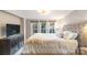 Comfortable bedroom featuring a large bed, soft lighting, and a relaxing ambiance at 317 Commodore Loop, Mooresville, NC 28117