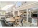 Open-concept dining area with adjacent living room and kitchen creating a large and inviting space for entertaining at 317 Commodore Loop, Mooresville, NC 28117