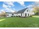 Beautiful exterior showcasing the well-manicured lawn, fresh landscaping and design of this charming home at 317 Commodore Loop, Mooresville, NC 28117