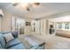 Open living room with comfortable seating, neutral colors, and access to the bathroom and bedroom at 317 Commodore Loop, Mooresville, NC 28117