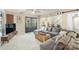 Cozy living room featuring comfortable seating, an entertainment center, and views into the dining area at 317 Commodore Loop, Mooresville, NC 28117