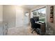 Functional home office space with a desk, gaming chair, ample light, and storage at 317 Commodore Loop, Mooresville, NC 28117