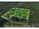 An aerial view of a heavily wooded lot at 332 York Spann Rd, Hamptonville, NC 27020