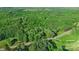 Aerial view of a wooded area with a road nearby at 332 York Spann Rd, Hamptonville, NC 27020