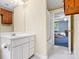 Bathroom featuring white vanity with mirror and view of bedroom at 332 York Spann Rd, Hamptonville, NC 27020
