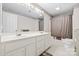 Well-lit bathroom boasts double vanity, mirrors and shower and toilet at 332 York Spann Rd, Hamptonville, NC 27020
