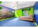 Large bedroom features unique wall paint and a comfortable bed at 332 York Spann Rd, Hamptonville, NC 27020