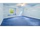 Unique bedroom features custom cloud paint on walls, a window seat, and a ceiling fan at 332 York Spann Rd, Hamptonville, NC 27020