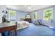 Spacious bedroom with three windows allowing for plenty of natural light at 332 York Spann Rd, Hamptonville, NC 27020