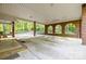 Spacious covered parking area featuring brick columns with arched openings and ample space for vehicles at 332 York Spann Rd, Hamptonville, NC 27020