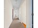 A carpeted hallway with access to multiple rooms in the home at 332 York Spann Rd, Hamptonville, NC 27020