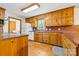 Open kitchen featuring wooden cabinets, modern appliances, and a breakfast bar at 332 York Spann Rd, Hamptonville, NC 27020
