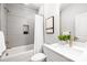 Bathroom with white tiles, shower-tub combination, vanity, and modern fixtures at 3888 12Th Ne St, Hickory, NC 28601