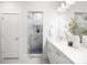 Modern bathroom featuring a marble walk-in shower, white vanity, and neutral color scheme at 3888 12Th Ne St, Hickory, NC 28601