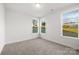 Bright bedroom with neutral walls, carpet and double windows at 3888 12Th Ne St, Hickory, NC 28601